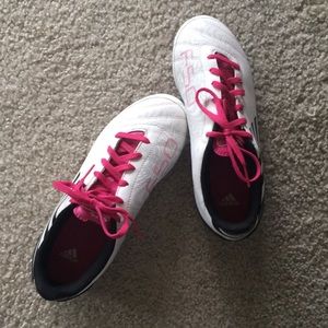 Pink and white adidas soccer cleats